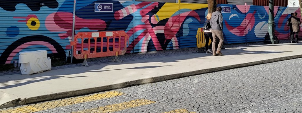 Street art hides construction mess. Porto, Portugal